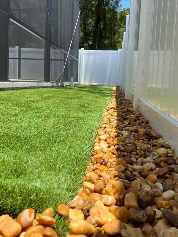 White river rocks installation River rocks professional installation in your backyard has great drainage, great look, and maintenance free.