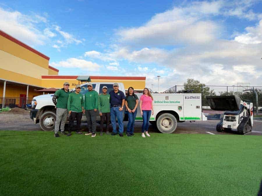 Professional team of artificial grass installation